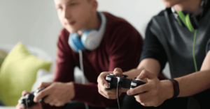 Two boys playing video games together