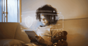 A child using a tablet, surrounded by digital security effects