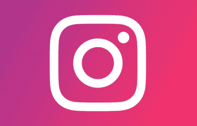 White instagram logo on a colourful background