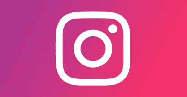 White instagram logo on a colourful background