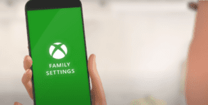 An animated image of a phone with XBOX logo on it