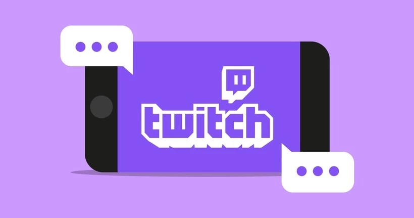 Il logo Twitch su uno smartphone circondato da fumetti.