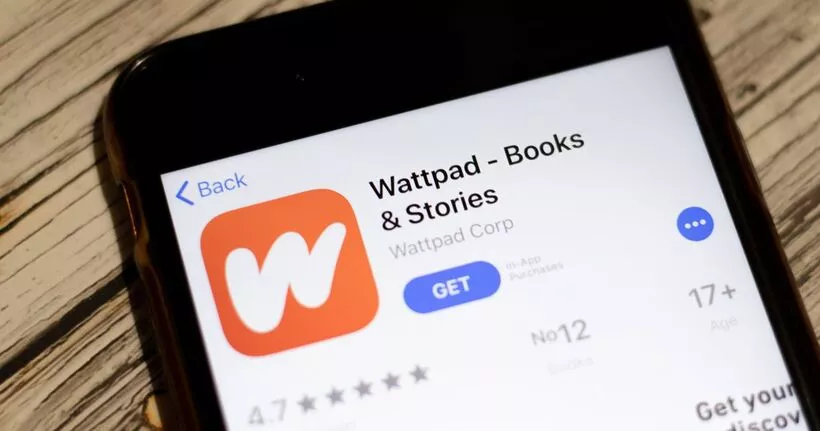 Smartphone with the Wattpad app in an app store.