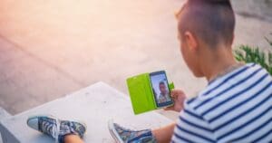 A boy looking at a phone