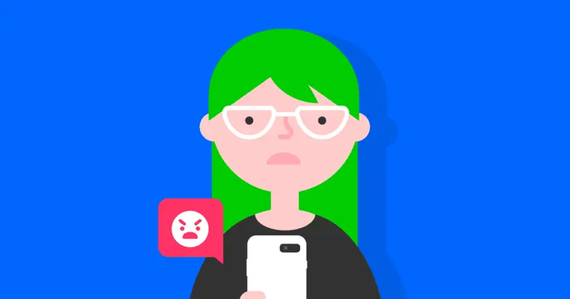 Sad girl with smartphone and a speech bubble with an angry emoji.