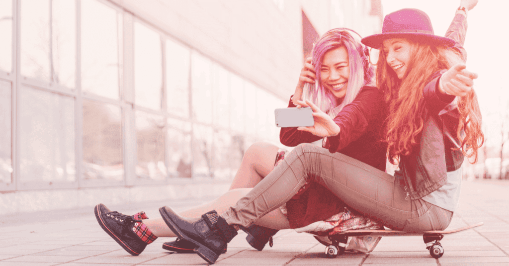 Teen girls looking at phone