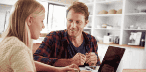 A daughter talking to her dad