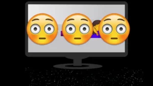 Três emojis de rosto envergonhado em frente a uma tela