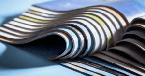 A pile of open magazines.