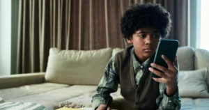 A boy using his phone