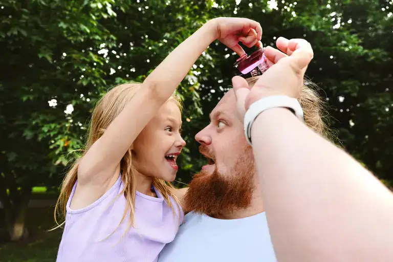 A father and daughter playing