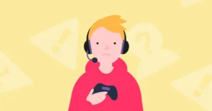A child holds a video game controller and wears a gaming headset while frowning.