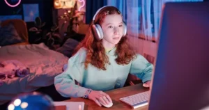 A teen uses a computer.