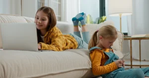 Siblings using devices together