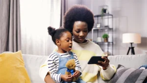 Mother and under 5 using device together