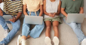 People using a range of devices.